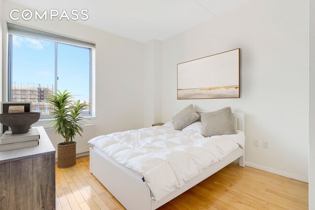 bedroom with wood finished floors