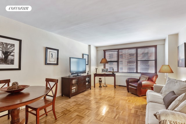 living area with visible vents and baseboards