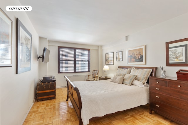 bedroom featuring baseboards and visible vents