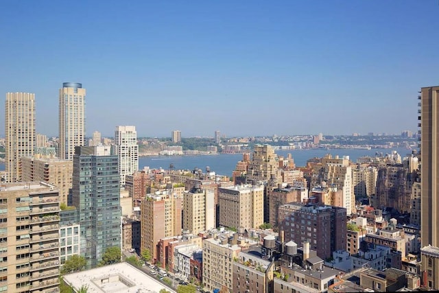 property's view of city with a water view