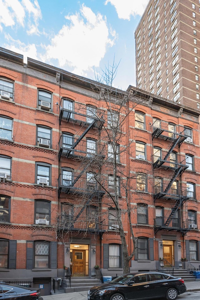 view of apartment building / complex featuring cooling unit
