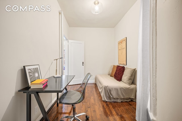 office space featuring wood finished floors and baseboards