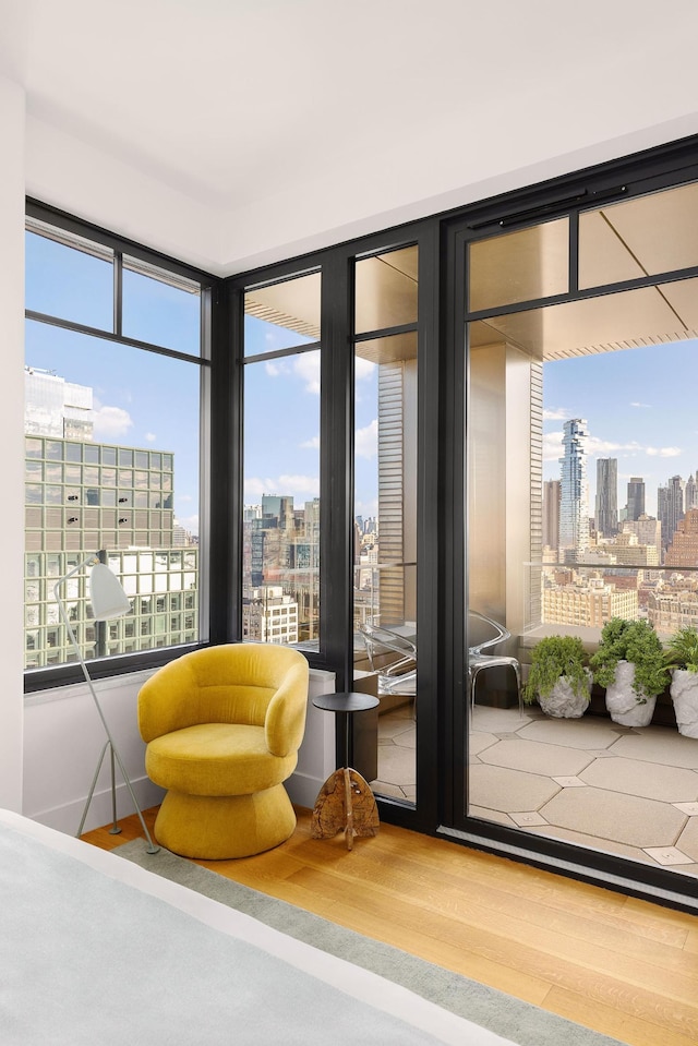 interior space with a view of city and wood finished floors