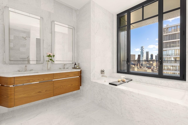 bathroom with a city view, a sink, a bath, and double vanity