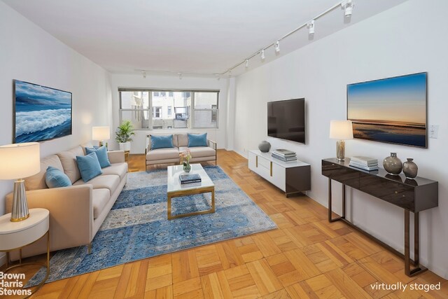 living room with light parquet floors and track lighting