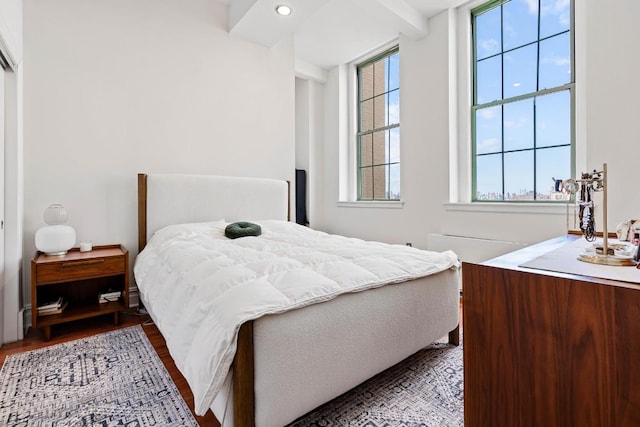 bedroom featuring beamed ceiling