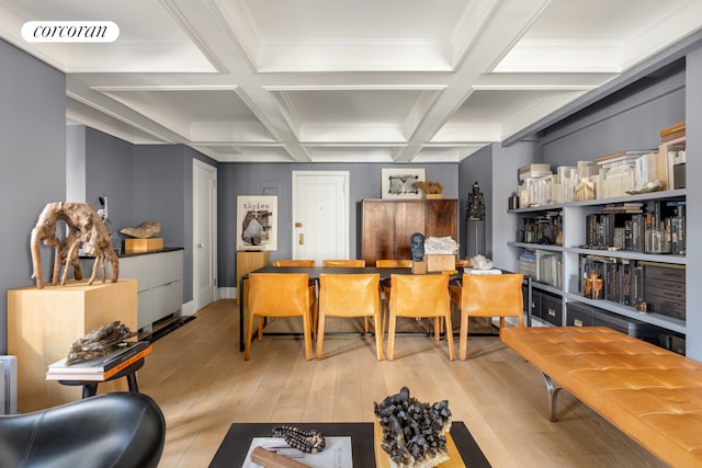 office with beam ceiling, visible vents, light wood-style flooring, and coffered ceiling