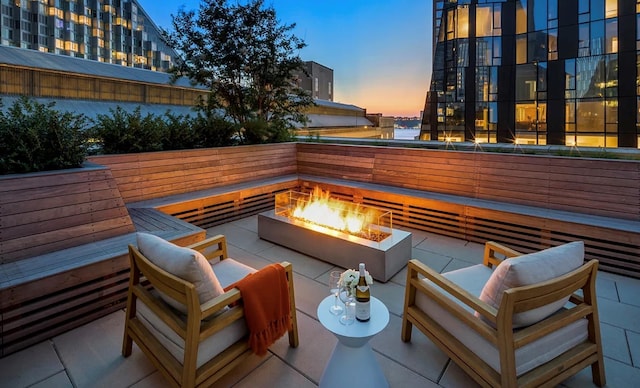 exterior space with a fire pit and a patio area