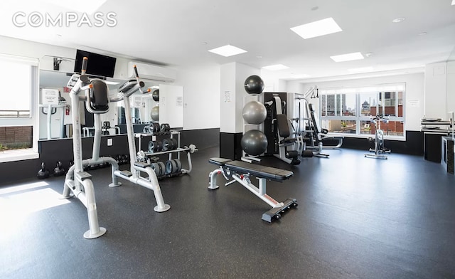 gym with a wall mounted air conditioner