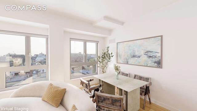 interior space featuring visible vents, baseboards, and wood finished floors