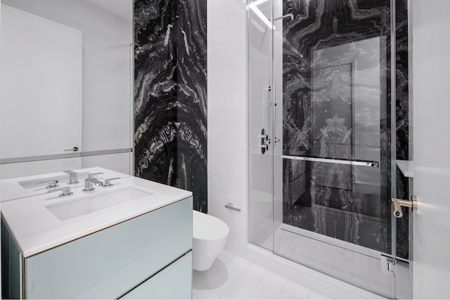full bathroom featuring toilet, a stall shower, and vanity