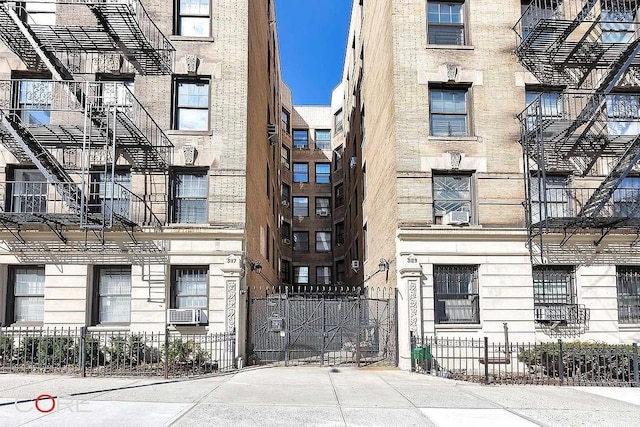 view of building exterior with fence