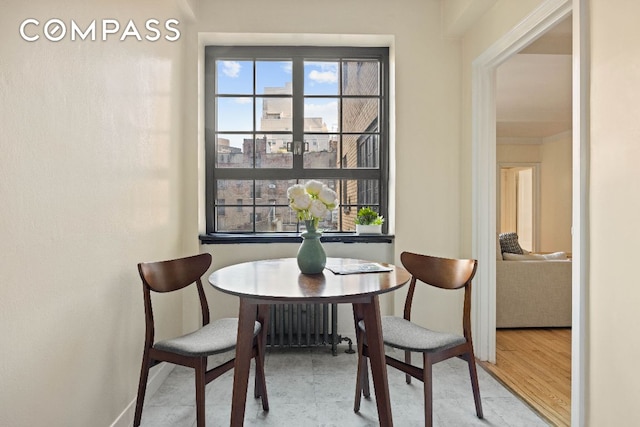 dining area with hardwood / wood-style flooring