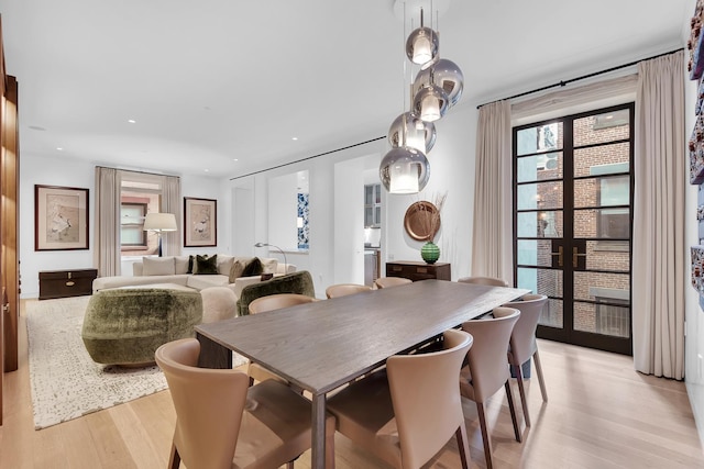 dining room featuring recessed lighting, light wood-style flooring, and french doors