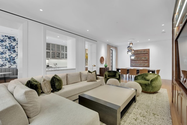 living area featuring wood finished floors and recessed lighting