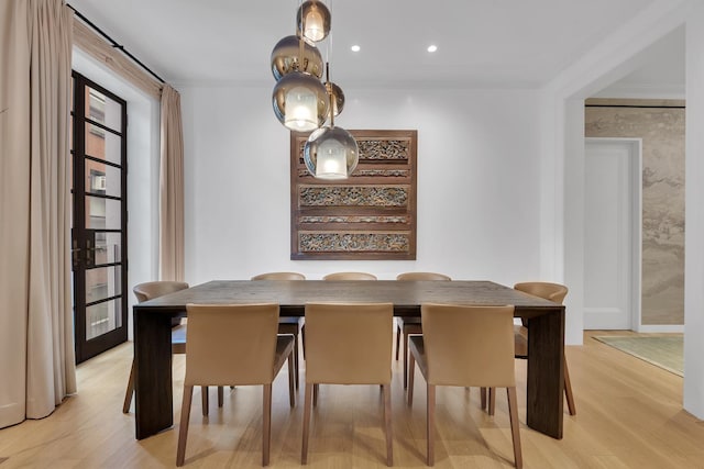 dining space featuring recessed lighting, baseboards, a wealth of natural light, and light wood-type flooring