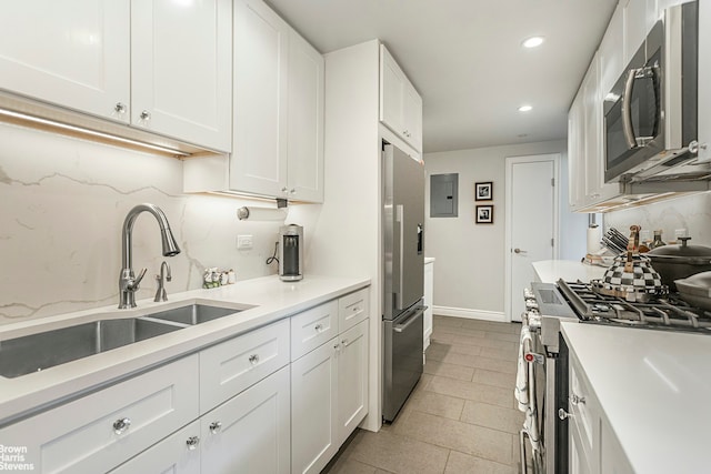 25 Sutton Pl S Unit 20J, New York City, NY 10022 - kitchen featuring a sink, stainless steel appliances, electric panel, recessed lighting, and light countertops