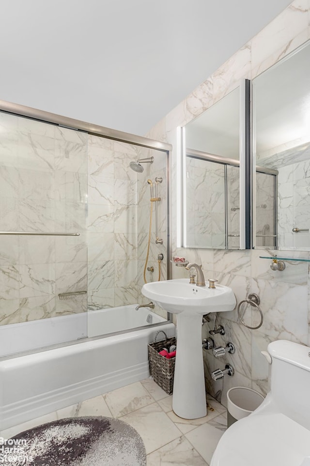25 Sutton Pl S Unit 20J, New York City, NY 10022 - bathroom featuring marble finish floors, shower / washtub combination, toilet, and tile walls