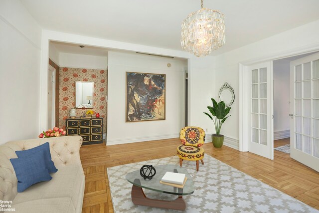 interior space featuring an inviting chandelier and parquet flooring