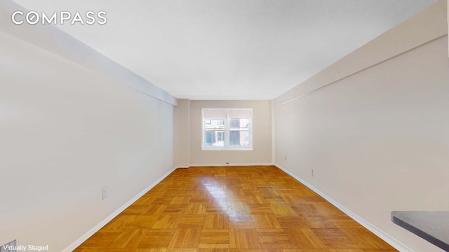 spare room featuring light parquet flooring