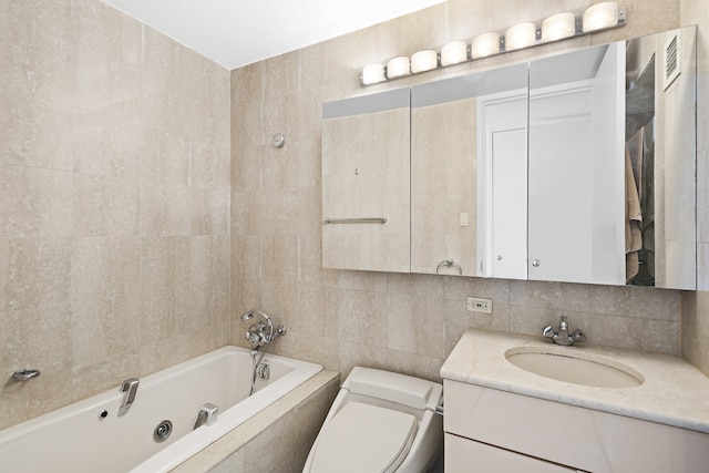 full bath with backsplash, tile walls, vanity, tiled shower / bath, and toilet