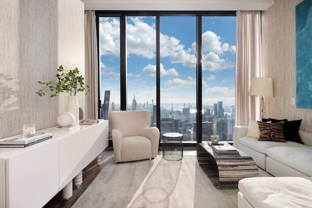 living room with a view of city and wood finished floors