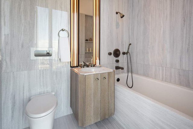 bathroom with shower / washtub combination, toilet, tile walls, and vanity