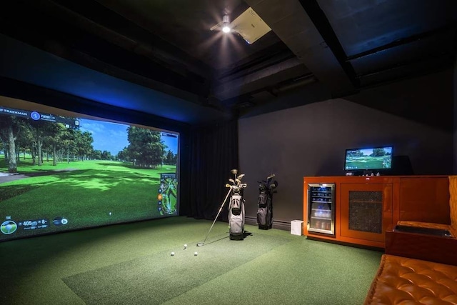 recreation room with wine cooler and golf simulator