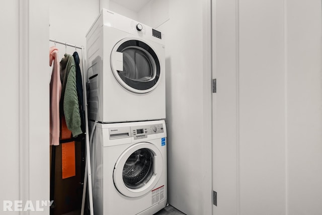 washroom featuring laundry area and stacked washer / drying machine