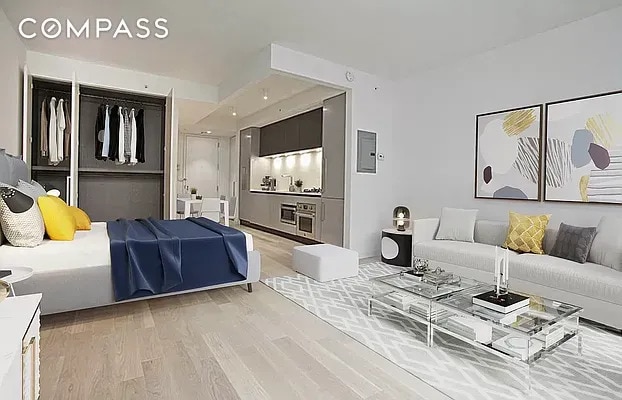540 W 49th St Unit 406N/407N, New York City, NY 10019 - bedroom featuring light wood-style flooring and a closet
