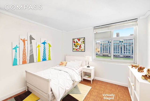 bedroom with crown molding and light parquet floors