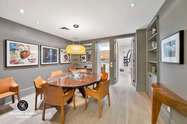 dining space featuring light hardwood / wood-style flooring