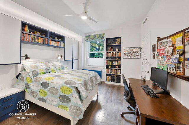 bedroom with ceiling fan and dark hardwood / wood-style floors