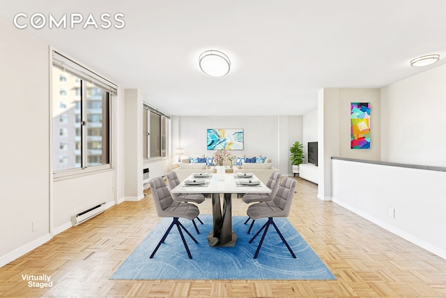 dining area featuring baseboards and a baseboard radiator