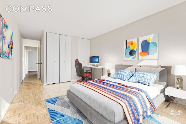 bedroom featuring a closet and light parquet floors