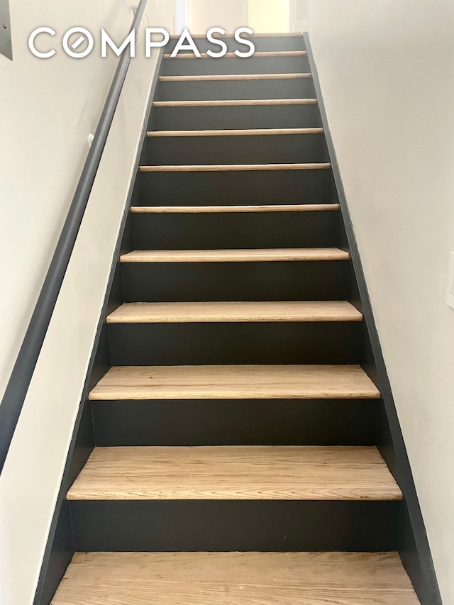 stairs with wood finished floors