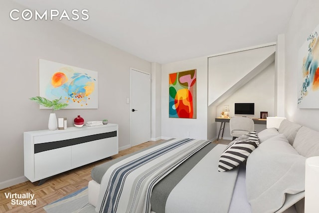 bedroom featuring light parquet floors