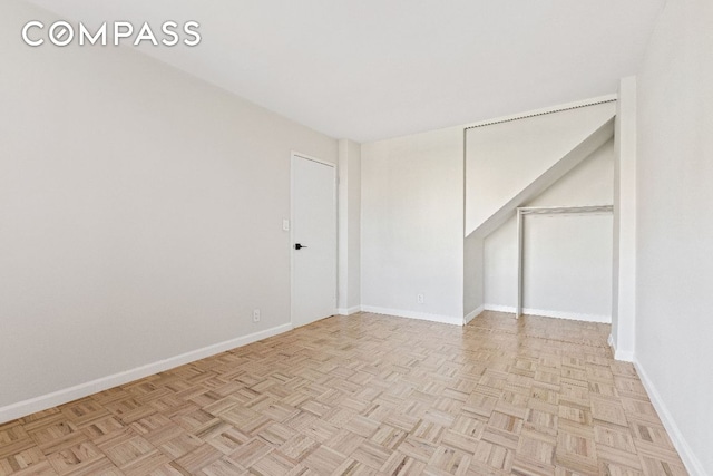 spare room with light parquet flooring