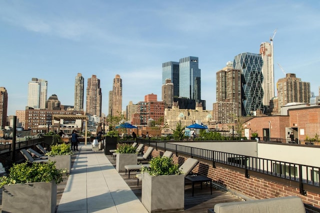 416 W 52nd St Unit Th213, New York City, NY 10019 - view of community featuring a skyline view