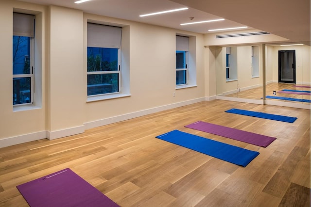 416 W 52nd St Unit Th213, New York City, NY 10019 - workout room featuring wood finished floors and baseboards