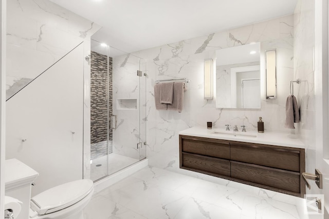 full bath with a marble finish shower, toilet, marble finish floor, and vanity