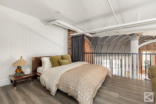 bedroom featuring wood finished floors