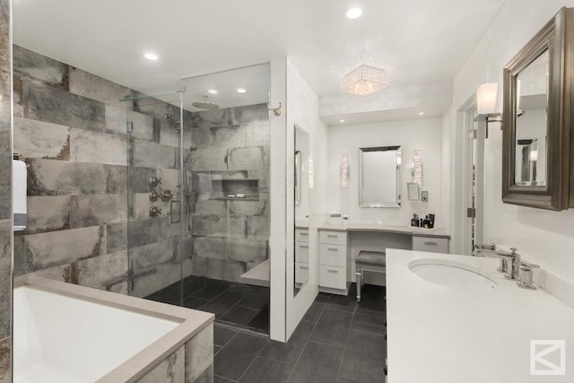 bathroom featuring vanity, a shower stall, and recessed lighting