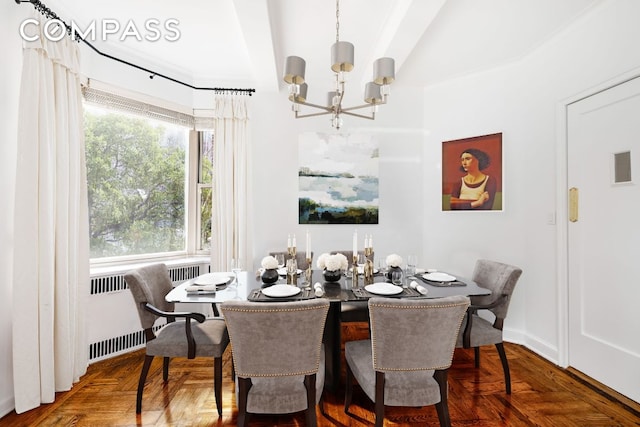 dining area with parquet floors, a notable chandelier, and radiator