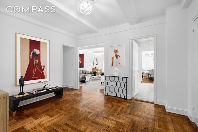 hallway featuring beam ceiling, a chandelier, and dark parquet floors