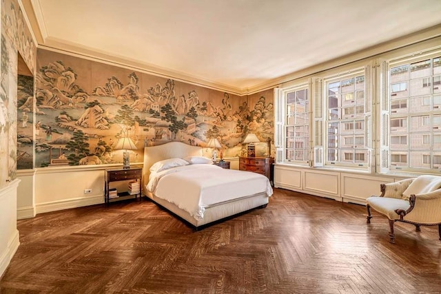 bedroom with dark parquet flooring and ornamental molding