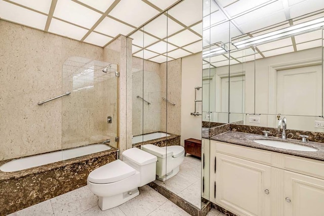 full bathroom with tiled shower / bath, vanity, toilet, and tile patterned flooring