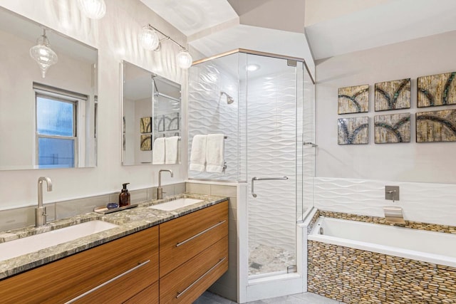 full bathroom featuring a shower stall, a bath, double vanity, and a sink