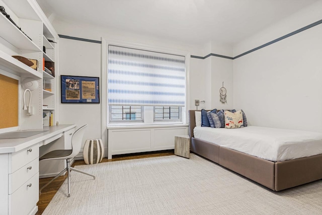 bedroom featuring wood finished floors