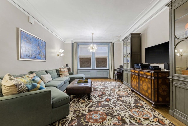 living room with wood finished floors and ornamental molding